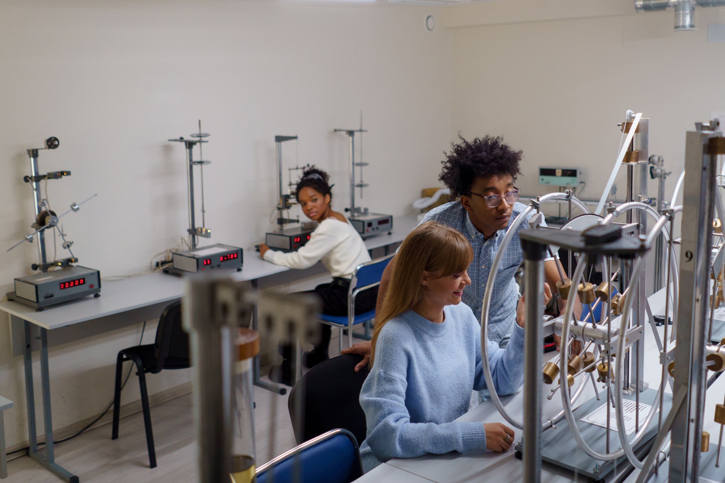 Students carrying out a practical experiment in a modern university laboratory