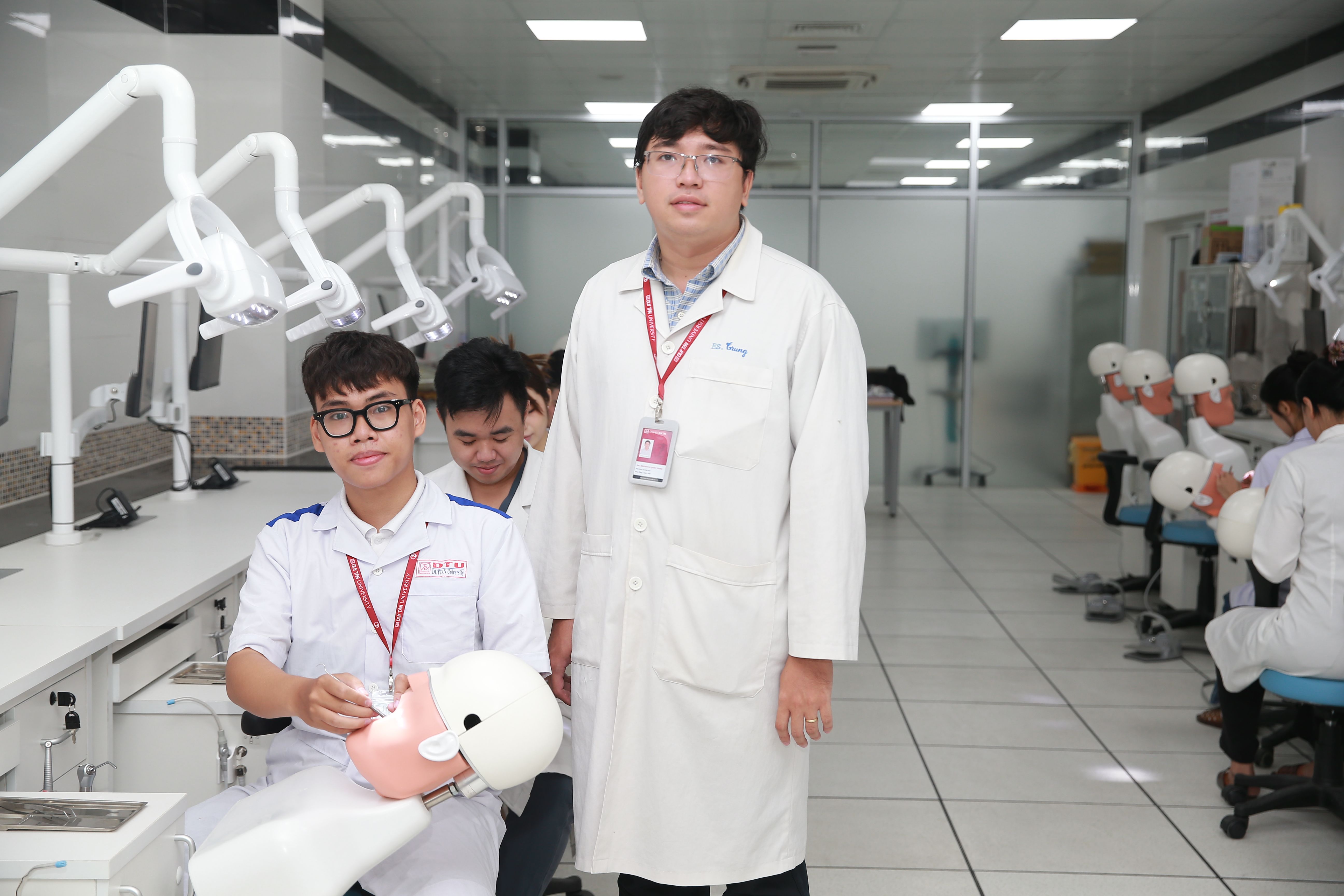 Dental students practising clinical skills on training models in a simulation laboratory