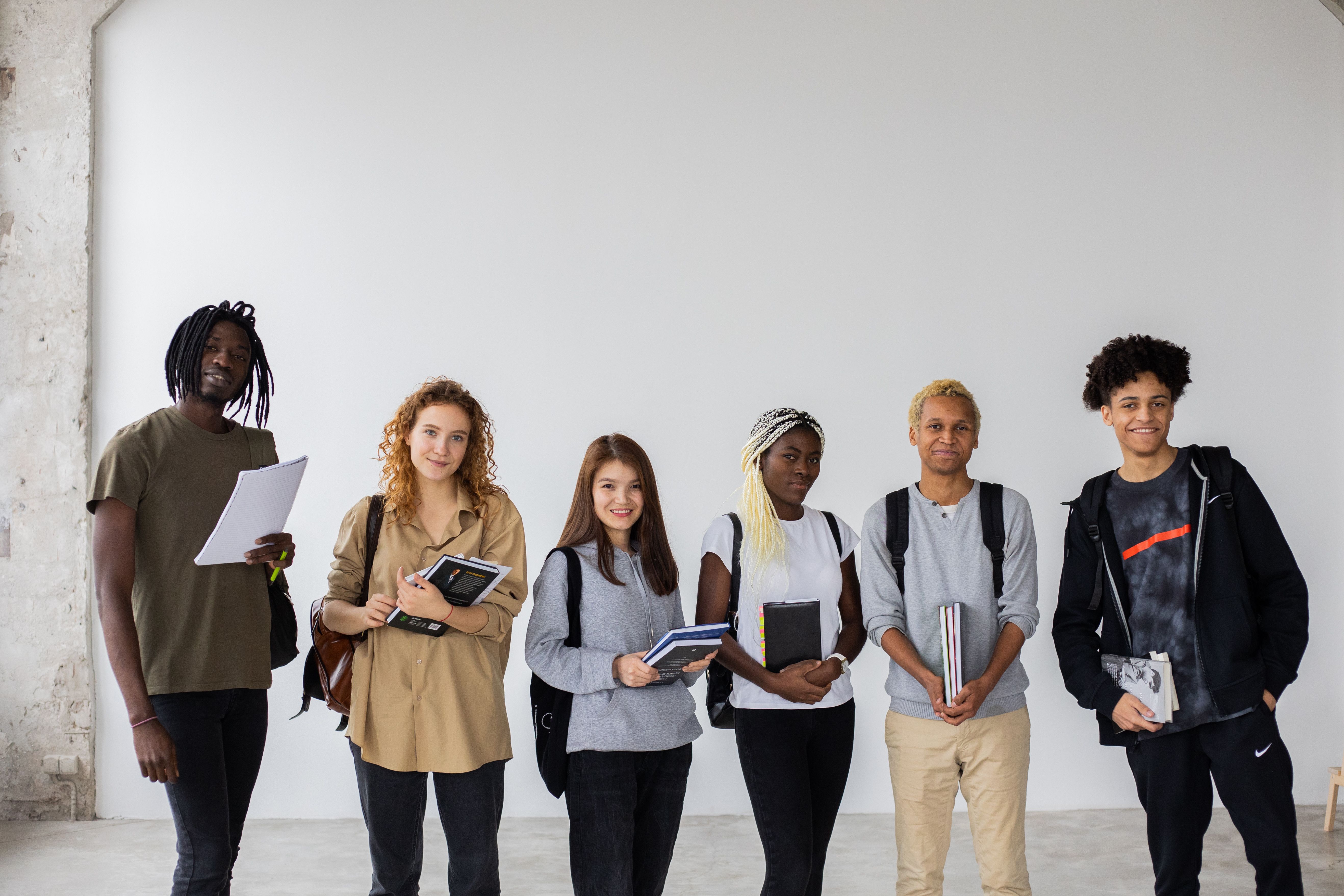 Students from different countries discuss an academic project at a European university