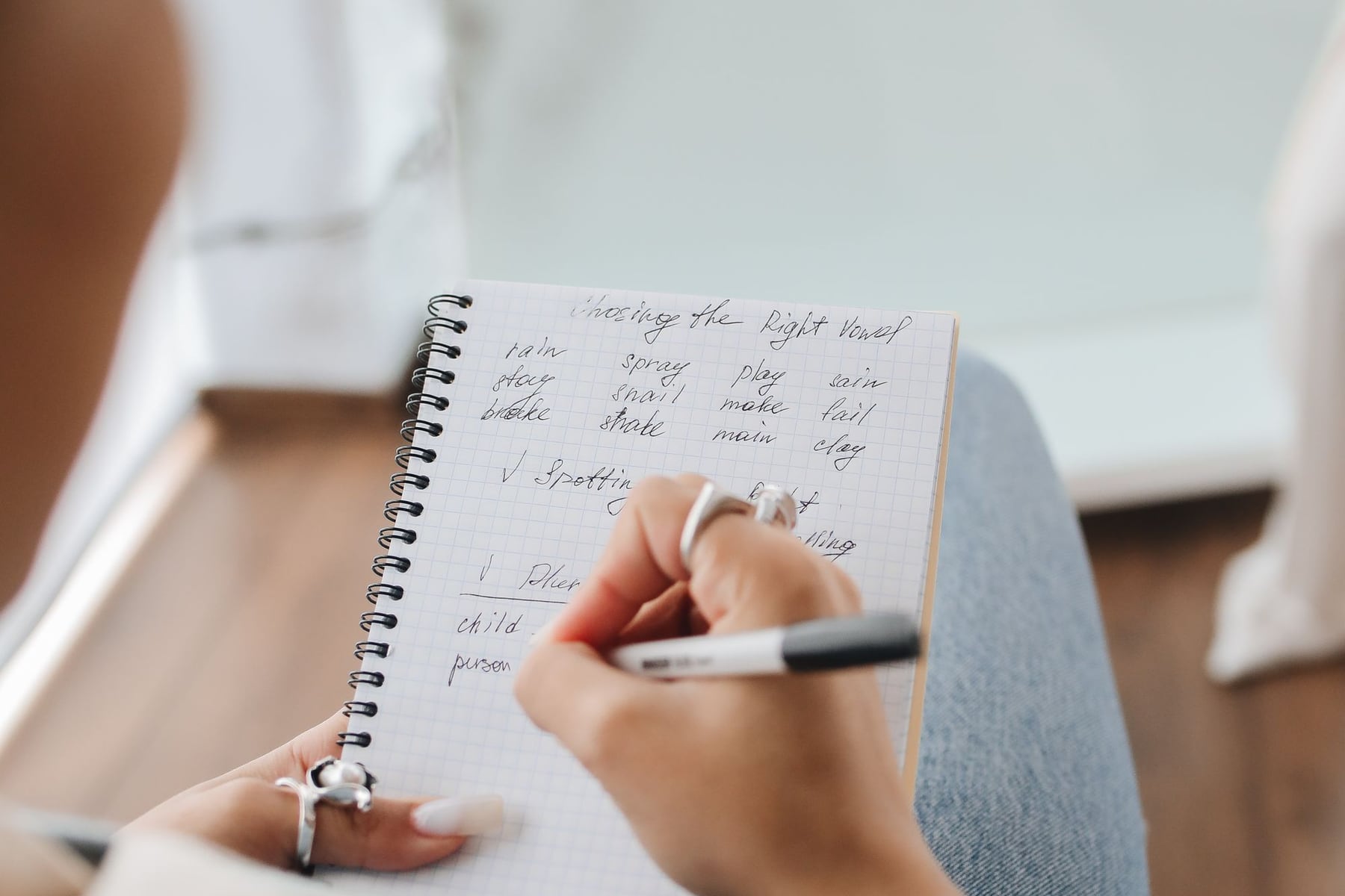 A student making notes while preparing a university application