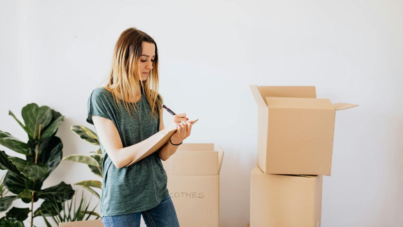 A student preparing belongings while planning a move into student accommodation