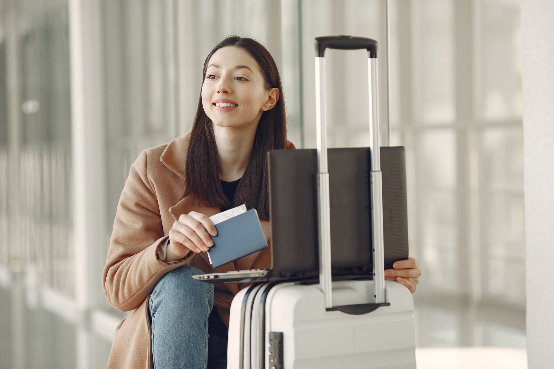 A student with her passport and documents preparing to travel abroad for study